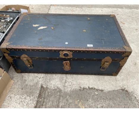 A VINTAGE TRAVEL TRUNK BEARING THE INITIALS C.A.L 