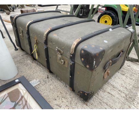 A VINTAGE COMPRESSED FIBRE TRAVEL TRUNK BEARING THE INITIALS L.M.P 