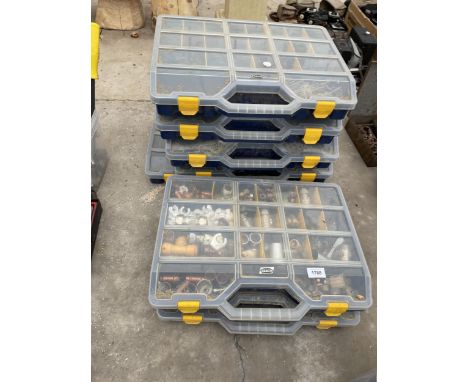 SEVEN PLASTIC HARDWARE STORAGE BOXES WITH A LARGE ASSORTMENT OF HARDWARE TO INCLUDE PIPE FITTINGS AND SCREWS ETC 