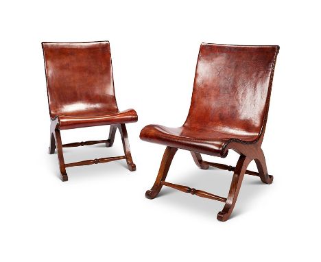 A pair of vintage Spanish tan leather and elm slipper chairs by Pierre Lottier for Valenti&nbsp;
With close-nailed shaped sea