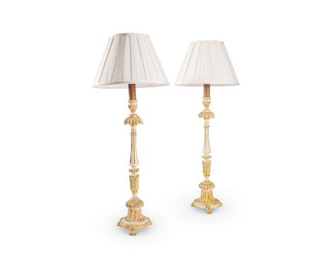 A near pair of tall late 19th century French candlesticks/ lamp bases
In the Louis XVI style, later painted in white and parc