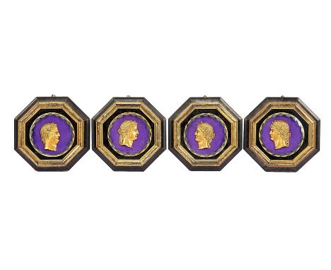 A set of four Regency style gilt portrait medallions
Depicting Roman Emperors, in verre eglomisé mounts and ebonised frames, 