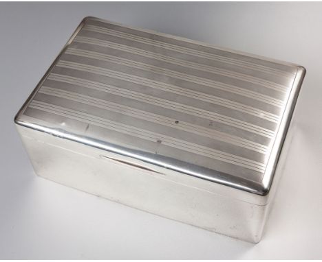 Rectangular, the hinged engine-turned cover enclosing a partitioned cedar-lined interior11,5cm high, 29,5cm long, 19cm deep, 
