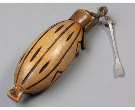 Long, oval snuff container carved in light wood, short neck covered with small metal strip, wooden stopper still in place, sh