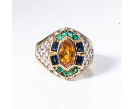 Centred with a fancy octagonal-cut yellow sapphire, flanked by pairs of baguette-cut blue sapphires and embellished with roun