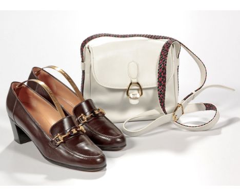 Comprising: a pair of heeled brown leather moccasins, gold-tone horsebit detail and classic Celine design logo detail, size 3
