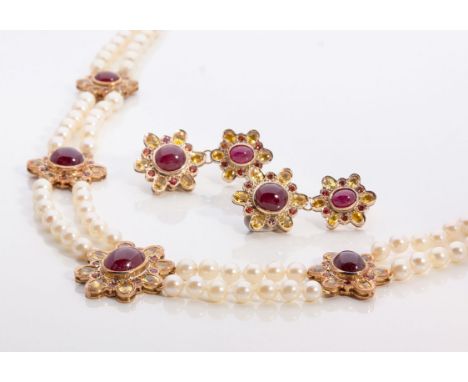 The necklace designed as two strands of pearls measuring approximately 6mm diameter spaced to the centre with five stylised f
