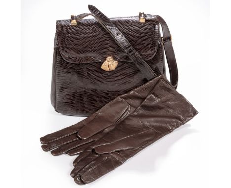 Comprising: a mocha brown lizard skin handbag accompanied by a kid leather coin purse, adjustable handle, gold-tone bow detai