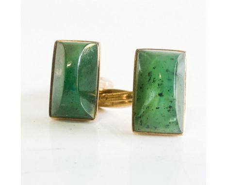 Each bezel set with a rectangular cabochon jade-like stone, with torpedo fittings, in 9ct gold