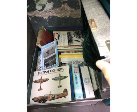 A vintage metal trunk full of avaiation/military books 