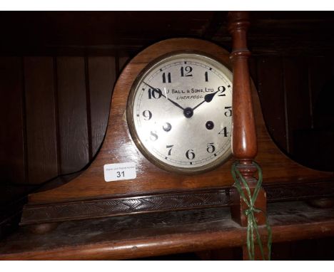 A steel dial mantle clock signed J Ball &amp; Sons Ltd Liverpool striking on single gong, length 41cm. 