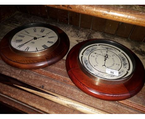 A reproduction wall clock and a barometer. 