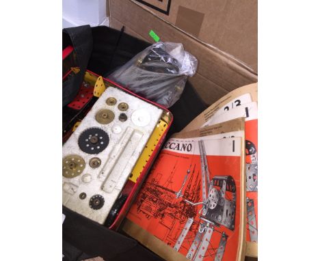 A bag of Meccano with vintage instruction vbooklets 