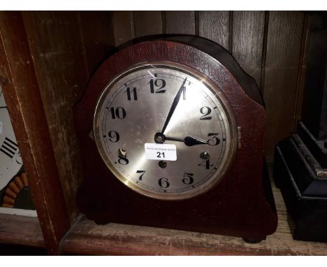 A domed chiming mantle clock, height 16cm. 