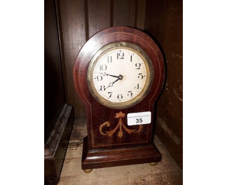 An Edwardian inlaid mahogany balloon mantle clock, height 23cm. 