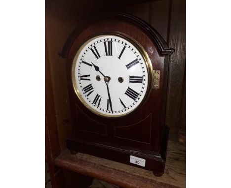 A domed mahogany twin fusee mantle clock striking on double coils, height 39cm. 