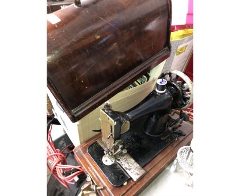 A vintage hand cranked Singer sewing machine 