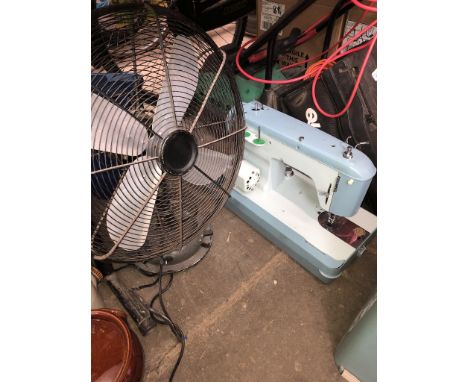 A Jones sewing machine - no power lead or foot pedal, and a vintage electric fan 