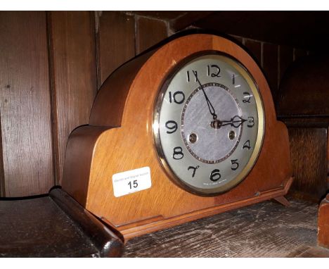 A retro Smiths light wood chiming mantle clock, height 21cm.Condition: Arabic numerals have been painted over, comes with pen