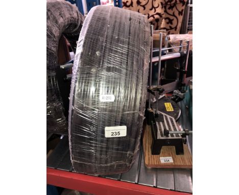 A roll of plastic water pipe 