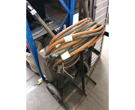 A 2 gas bottle carrier with hoses and a vintage electric heater 