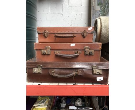 Three graduated leather vintage suitcases 