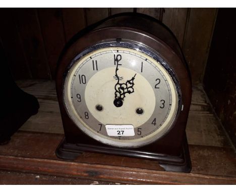 A Smiths Enfield bakelite domed mantle clock striking on single coil, height 20cm. 