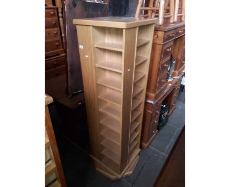 A modern light wood large revolving bookcase cabinet.&nbsp;Width 46.6cm, depth 46.5cm &amp; height 161.5cm. All shelves adjus