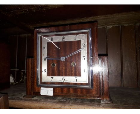 An Art Deco oak mantle clock striking on single coil, height 20cm. 