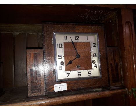 An Art Deco inlaid oak chiming mantle clock, length 33cm. 