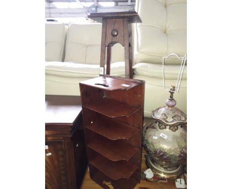 An arts and crafts style oak plant stand and a 19th century mahogany partitioned letter/stationary rack.Condition: some stain