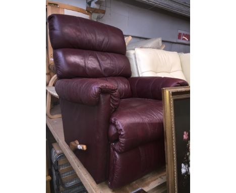 A crimson leather La-Z-Boy manual reclining armchair 