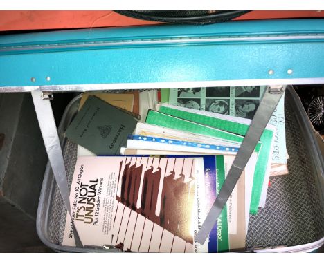 A vintage case with organ sheet music 