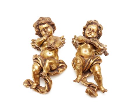 Gilt resin putti playing trumpet and violin 40cm wide Condition: The bow is missing, the putti with the trumpet certainly fel