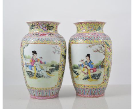 Pair of Chinese yellow ground vases, of shouldered form, decorated in a famille rose palette with stylised foliage,the reserv