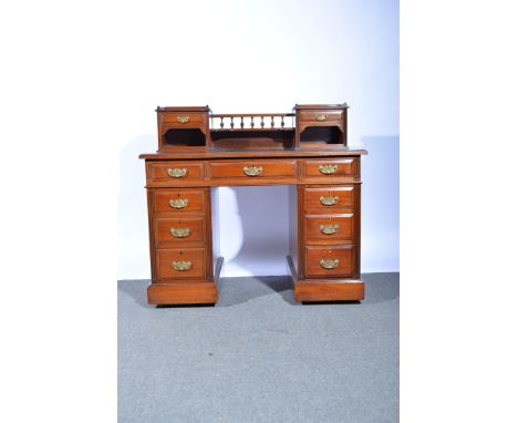 Victorian walnut desk, raised superstructure with spindle gallery, drawers and a shelf, the base with a rectangular top  and 