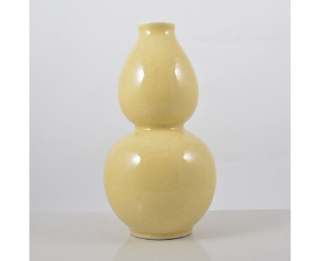 Chinese yellow ground double gourd shape vase, lightly incised decoration of foliage, four character seal mark, 20cms. 