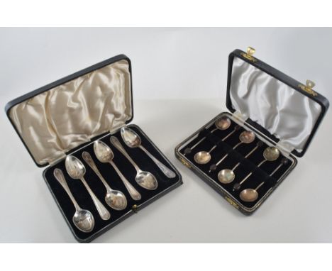 A cased set of silver coffee bean spoons, Birmingham 1955, teaspoons with bell flower border, Sheffield 1915, teaspoons with 