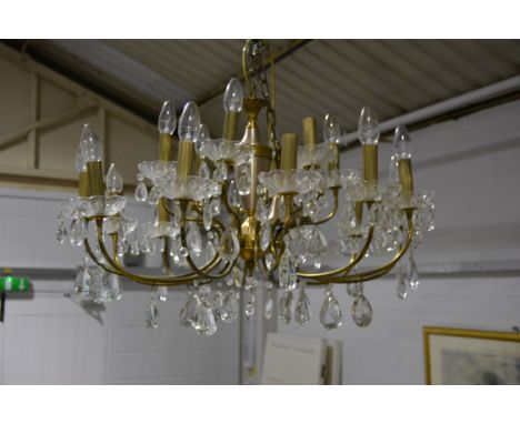 Pair of twenty light two tier chandeliers, with faceted drops and an electric candle fitments, diameter 82cm.