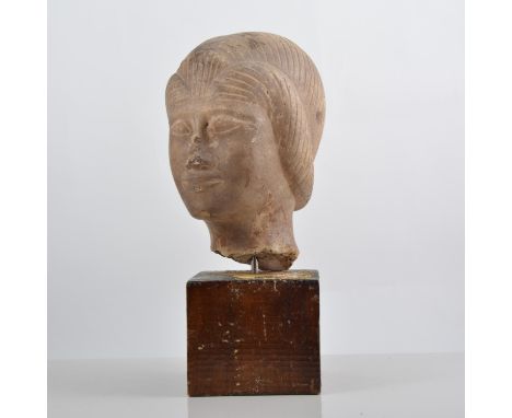 Carved marble portrait head, set on a square stained plinth, 30cms overall.