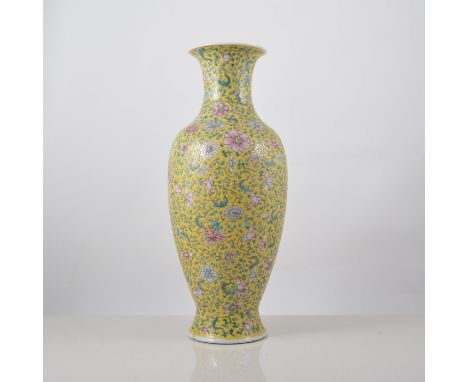 Chinese yellow ground baluster shaped vase, decorated with stylised flowers, bearing six character seal mark, (restored), 34.