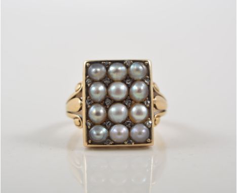 A pearl set yellow metal dress ring, the rectangular head 15mm x 12mm, pave set with twelve half pearls interspersed by seven