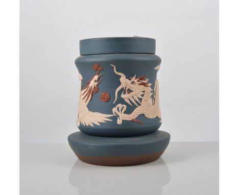 Chinese blue ground jar, Yixing type, applied moulded decoration of a dragon and phoenix , seal mark, 16cms.