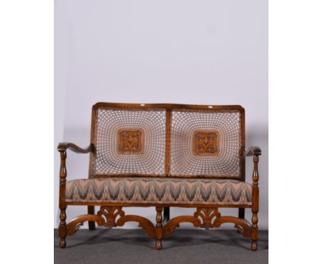 Small beechwood two seater settee, caned panelled backs, shaped arms, turned legs with carved front rails, width 115cms, dept