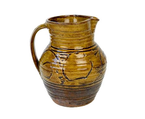 Michael CARDEW (1901-1983)  A brown jug with sgraffito decoration and ochre glazeHeight 18 cmImpressed MC and Wenford Bridge 