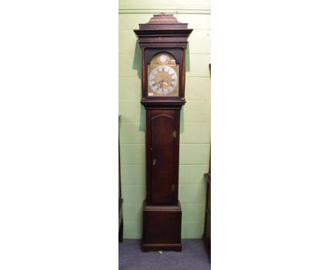 ~ An oak thirty hour longcase clock, arch brass dial with silvered disc inscribed W Porthouse, Barnard Castle