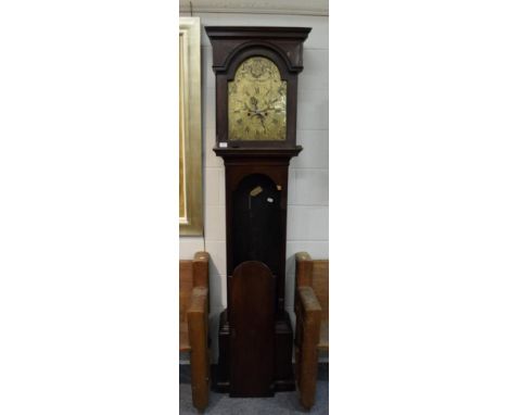 ~ A mahogany eight day longcase clock, one piece silvered brass dial with engraved scenes and family crest in the arch, signe