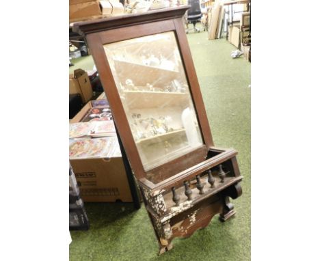 A 19thC mahogany mirror, with bevelled mirror plate, and shelf below, 76cm high. 