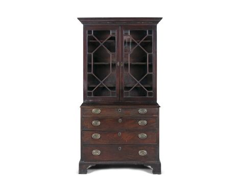 A 19TH CENTURY MAHOGANY COMPOSED BOOKCASE, with moulded dentil cornice above twin astragal glazed panel doors, on a chest of 