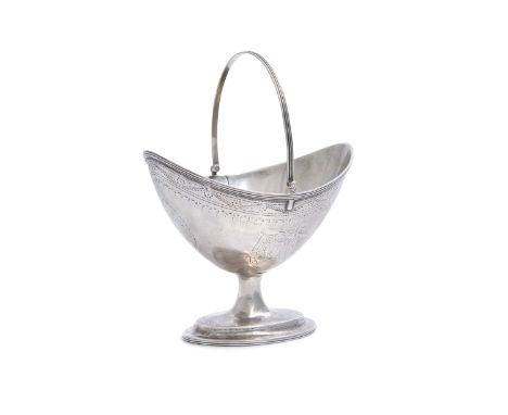 A GEORGE III IRISH SILVER BRIGHT-CUT SWING HANDLE SUGAR BASKET, Dublin c.1792, lacking maker's mark, of helmet form, raised o